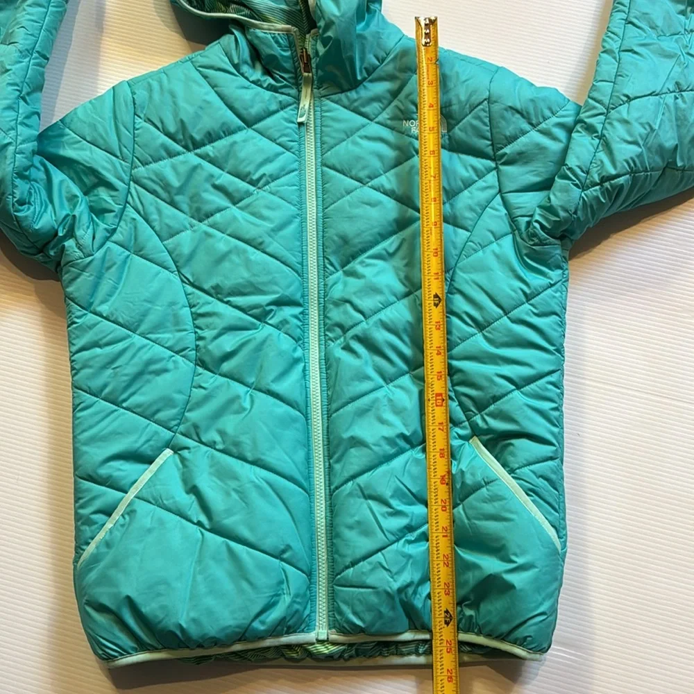 The North Face reversible puffers jacket.  Green, yellow, white swirl. Girls XL